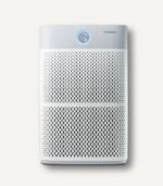 Full front view of the white Coway AP-3018B Ultra Air Purifier, showcasing its large front intake grill and intuitive circular LED air quality display.