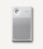 Front view of the white Coway AP-1018F slim air purifier, showcasing its clean, minimalist design and circular air quality indicator.
