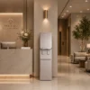 Coway CHPI-620L Plus standing ice water purifier installed in a luxury medical clinic lobby, featuring a sleek silver design and high-capacity ice making.