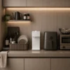 Coway P-2201N Switch water purifier in white, featuring a slim non-electric design integrated into a modern kitchen interior.